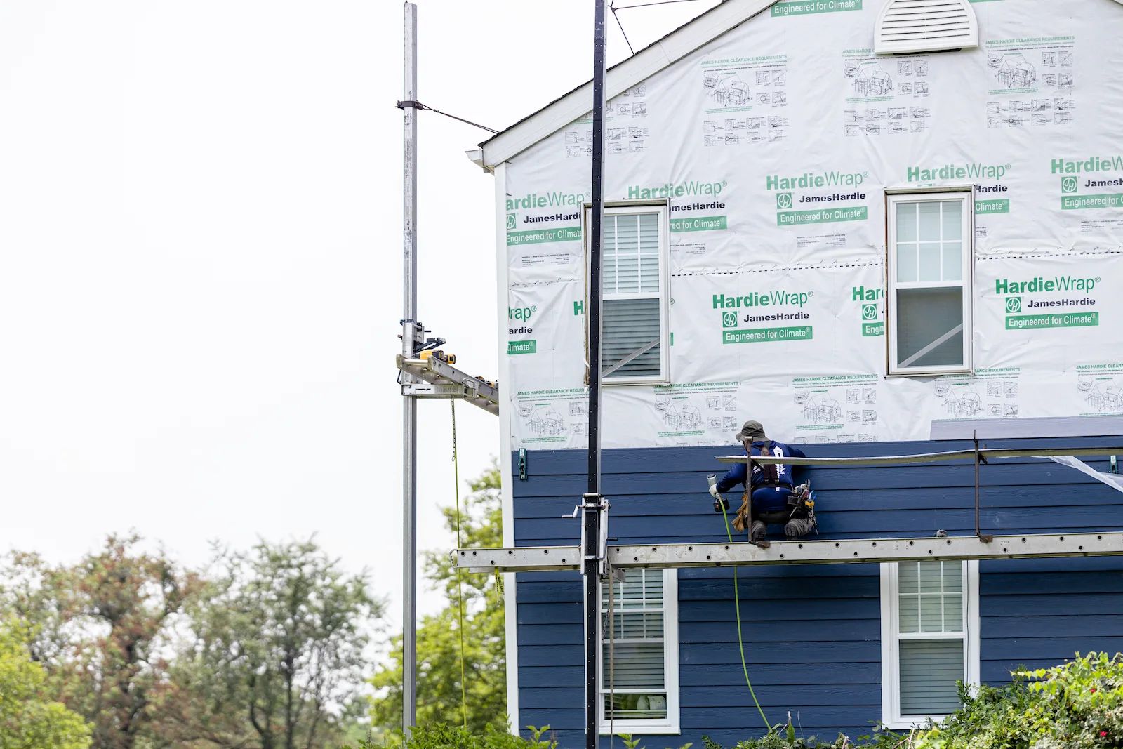 Installing new James Hardie lap siding. 